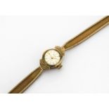 A 1970s Avia 9ct gold lady's wristwatch, 14.2g, AF the clasp is cracked and not sure if it running