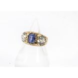 A late Victorian 15ct gold sapphire and zircon ring, the heavy thick tapering band set with a pair