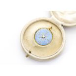 An Edwardian gold and enamel seed pearl circular locket, in fitted J C Vickery case, the circular