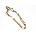 A Victorian 9ct gold bracelet, with three strands of facet oval links and chased terminals with a