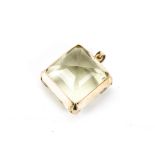 A very large citrine pendant, the square step cut green tinged stone in a high carat frame mount