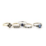 Five gold rings, one white metal with three stones marked 14k, a sapphire and diamond example, an