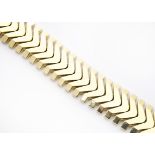 A continental high carat gold retro style chevron linked bracelet, with snap clasp, safety clasps
