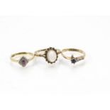 Three Art Deco and later gold and gem set rings, one 18ct gold with platinum tablet centred by a