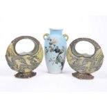 A pair of Japanese porcelain 'handbag' vases, applied dragon decoration, 16.5 cm high, marked to