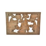 A Yoruba carved wooden panel, depicting a blessing ceremony, 31.5 cm x 45.5 cm; together with a