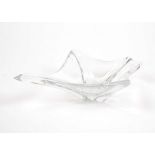 A Daum France crystal bowl, constructed of clear glass with elongated sides of organic form, base