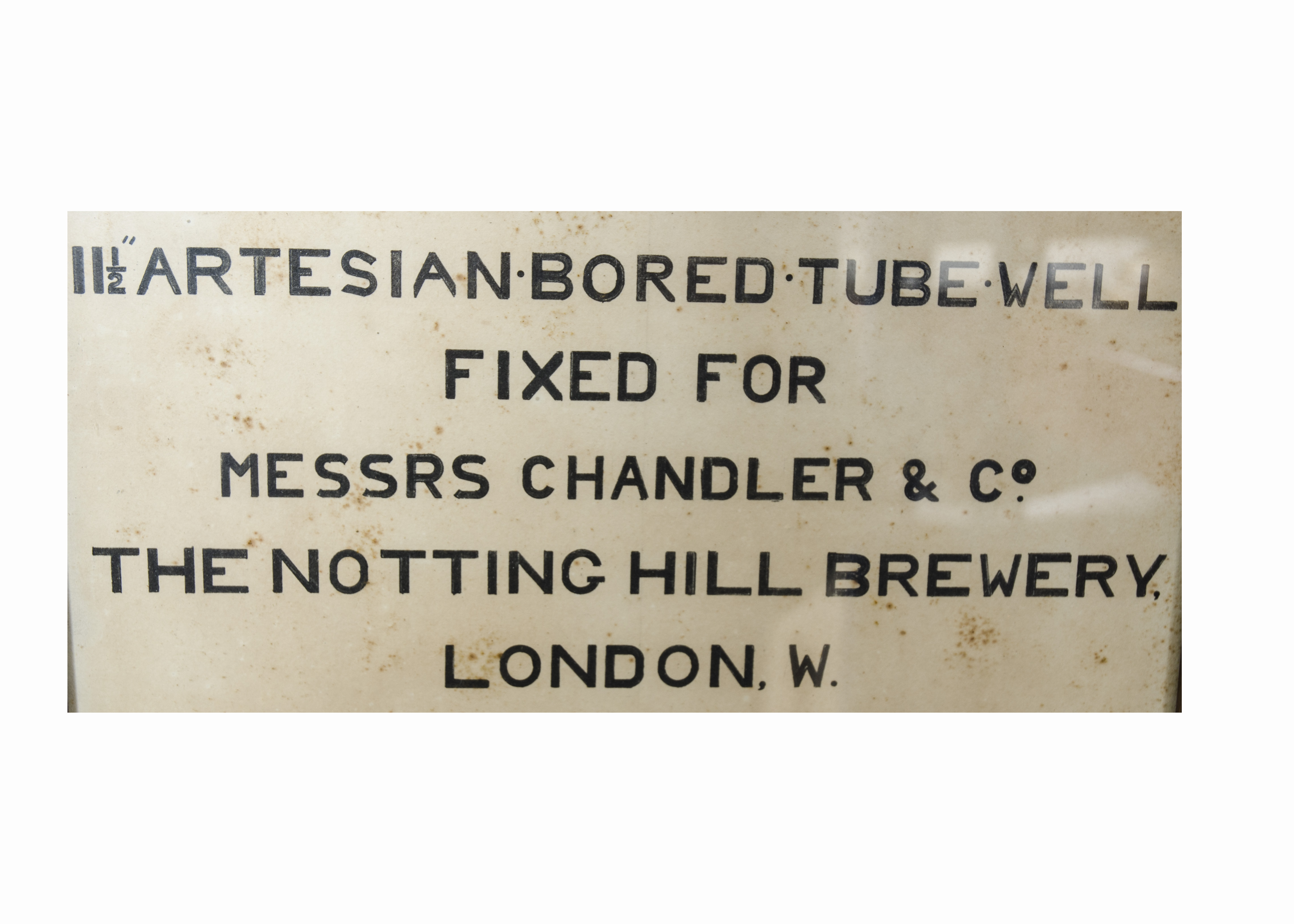 A framed artesian bored tube well by C. Isler & Co, 'fixed for Messrs Chandler & Co', displaying a