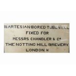 A framed artesian bored tube well by C. Isler & Co, 'fixed for Messrs Chandler & Co', displaying a