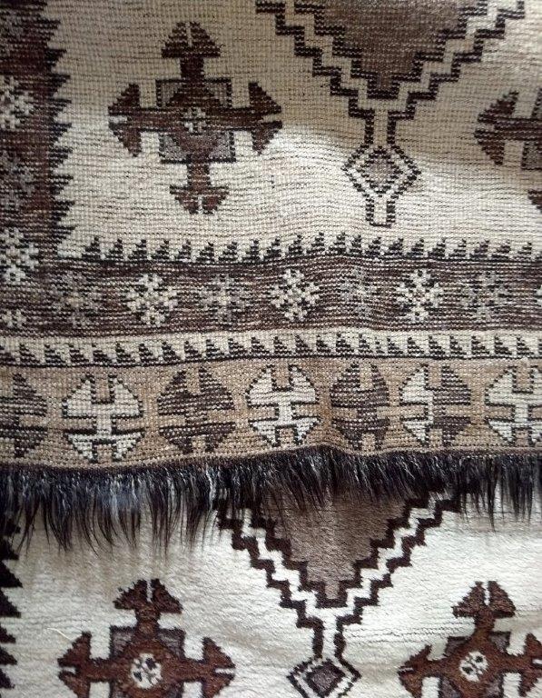 A mid 20th Century Kurdish rug, cream field with three large brown central hooked medallions and - Image 4 of 4