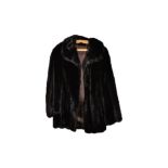 Two 20th Century fur coats, a rabbit fur three-quarter length coat, 85 cm, with a matching stole and