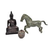 A wooden Buddha figure with carved features, 12.5 cm, together with a bronze horse, 12 cm and a