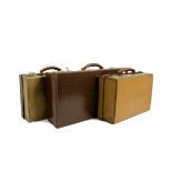 Five leather cases and document boxes, brown or tan leather with metal locks and fastenings, some