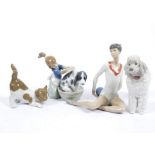 Four Lladro porcelain figures, comprising gymnast with ball, 15 cm high; poodle, 14.5 cm high;