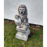 An Henri Studio concrete garden sculpture of a lion, right paw raised on a shield, plinth vase,