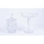 A cut glass comport, patterned bowl with lobed rim, faceted tapering stem, star cut circular base,