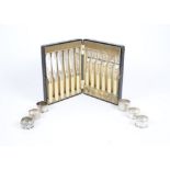 Five silver napkin rings, various styles and makers, together with a further white metal example;