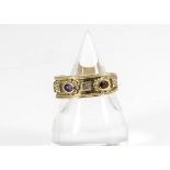 A 9ct gold Golden Jubilee Brooks & Bentley gem set dress ring, set with garnets, diamonds, amethysts