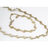 A contemporary 9ct gold matching necklace and bracelet, the shaped links with pierced decoration,