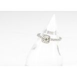 A contemporary diamond 18ct white gold set solitaire, the asscher cut central stone in four claw