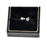 A pair of diamond ear studs, brilliant cuts in claw settings on 18ct white gold posts, total
