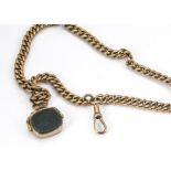 A 9ct gold curb linked fob chain, supporting a 9ct gold spinning fob with bloodstone and cornelian