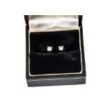 A pair of contemporary diamond ear studs, the brilliant cuts in 18ct white gold claw settings and