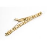 A 9ct gold three bar bracelet, the central link with diamond cut decoration, 7g