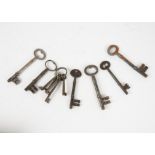 A collection of antique keys, including six Bramah, Chubb, Gibbons, Hobbs & Co., and others,