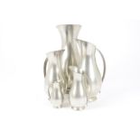 A set of five Royal Holland pewter jugs, of graduated size with fluted necks, 11-30 cm high (5)