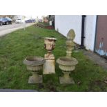 A Victorian white painted cast iron garden urn, tapering plinth base, together with two composite