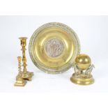 A Victorian brass inkwell, in the form of a hinged globe supported in the backs of three hounds,