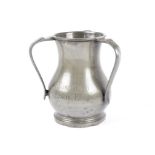 A three handled pewter tankard inscribed 'Echid Da I Lancia Eryri', marked 'London' next to a