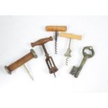 A large collection of corkscrews, with wooden, metal and plastic handles, including some novelty