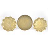 Two Middle-Eastern brass circular trays, extensive embossed decoration throughout, larger 73 cm