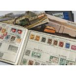 A collection of stamps, including a small album called World-Wide containg some 19th century