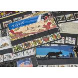 A collection of British stamps and First Day Covers, predominantly from the 1950s onwards, including