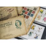 A collection of First Day Covers, mostly 1970s, in two albums,along with two schoolboy stamp albums,