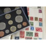 A collection of modern stamps and coins, including two albums of Royal Mail Mint presentation