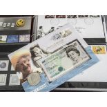 A collection of stamps and other items, including a Queen Mother £5 coin and note cover from 2000,