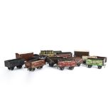 A Collection of 0 Gauge Wagons by LMC and Others, comprising 5 bakelite open wagons and two vans,