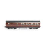 An Exley for Bassett-Lowke 0 Gauge K5 LMS Suburban Brake/3rd Coach, in LMS maroon, with running no