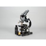 A Leitz black-enamelled Compound Binocular Microscope, serial no. 309110, with eyepieces (5),