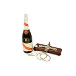 A bottle of G.H Mumm cordon rouge champagne, 75cl; together with a Watts Sheffield tie press, a