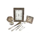 A collection of silver, including a modern silver framed mantle clock by Kitney & Co., London, 2000,