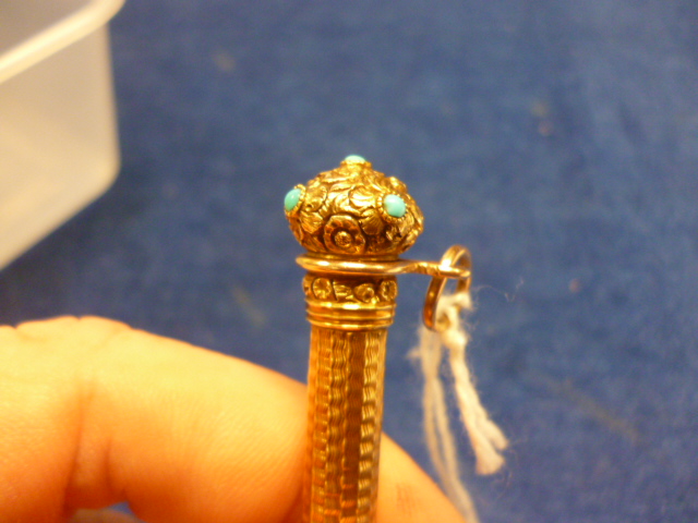 A Victorian gold retractable pencil, with engine turned body, possibly 15ct or 18ct gold, chased - Image 4 of 6