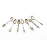 Seven silver souvenir teaspoons, one from Egypt, another marked The Burgh of Dollar and four