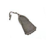 An art deco white metal mesh purse, with arched top, embossed floral decoration and blue paste