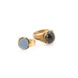 A continental gentleman's gold garnet set signet ring, the cabochon garnet in yellow metal mount