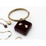 A quantity of 9ct gold, including a bangle, oval gold locket, various gold chains, (some af), and